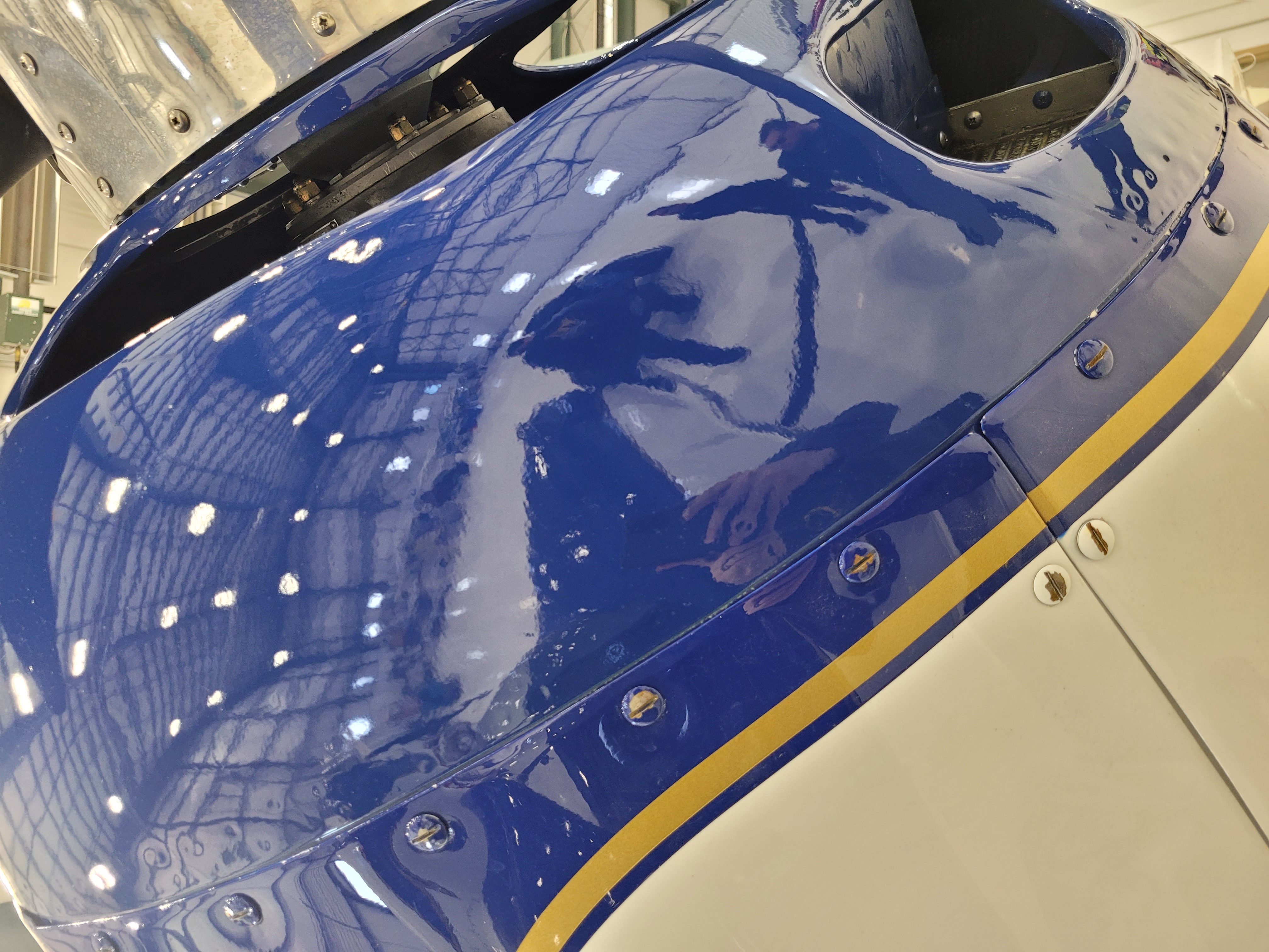 Completed Grumman cowling structural repair and refinishing by Flite Line Services